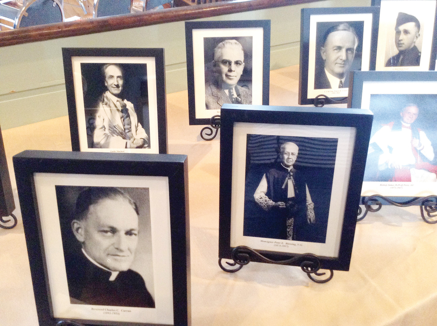 Photographs of several Rhode Islanders honored in the ceremony. Front row, left to right: Father Charles C Curran, Msgr. Peter Blessing and Episcopal Bishop James DeWolf-Perry, III.  Second row, left to right: Guido Nincheri, Speaker Harry Curvin, Chief Justice Francis Condon, 
and Lt. Robert Waugh Turner.